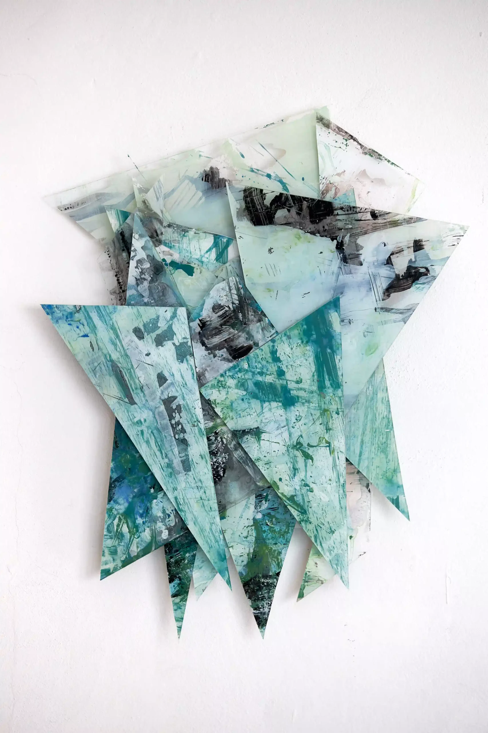 Hand painted acrylic on plexiglass sculpture by Marina Aristotel, Titled "Parts of the same you". Features irregular organic edges and layered translucent volumes. Vibrant green shades. Premium dimensional wall art for modern luxury interior and boutique hotels.
